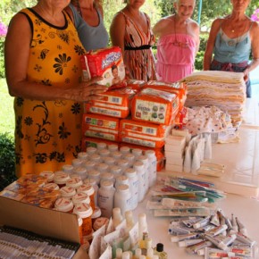 Patti, Jollie, Josefina, Joan, Barbara prepare to make baby bundles.